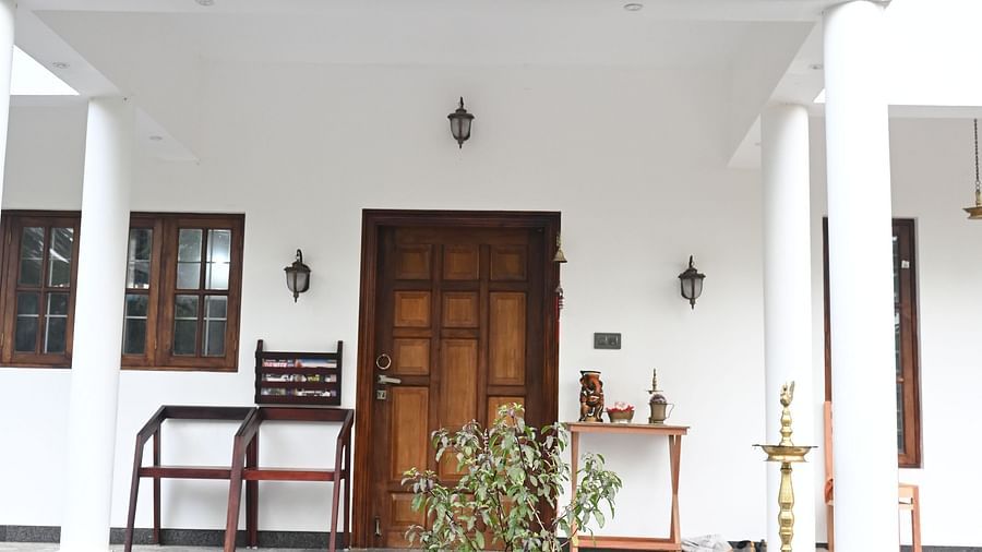Image of a Tulsi plant in front of the Facade of Ananda Holiday Home, Wayanad