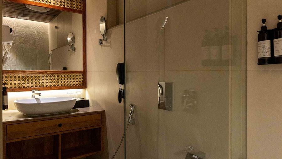 Bathroom of Coral Sapphire at Coral Reef Resort and Spa in Havelock featuring the view of the bathroom with toilet and sink from the bathtub space