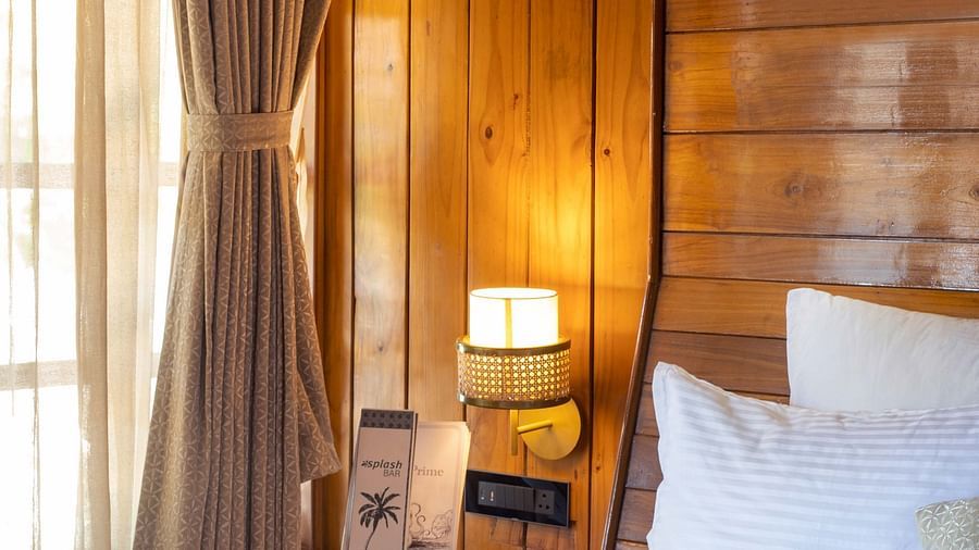 Coral Turquoise at Coral Reef Resort and Spa in Havelock featuring an angular shot of the plush bed with breakfast placed on it next to the window