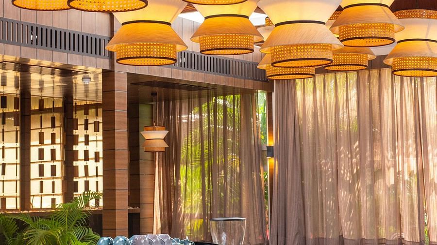 5th Bistro Cafe and Bar featuring a stylish bar area with contemporary lighting fixtures and modern furniture. The space is well-lit, creating an inviting environment for guests to relax and socialise - Coral Reef Resort & Spa, Havelock