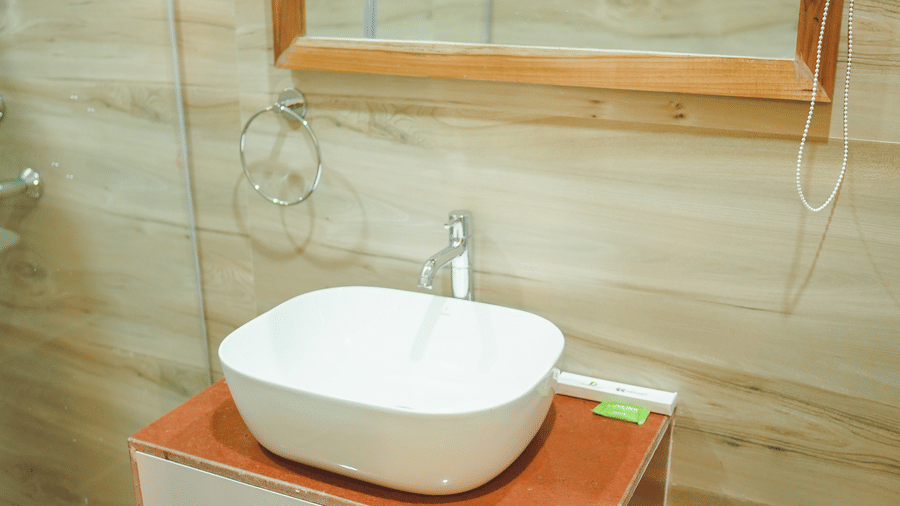 A wash basin with a covered vanity area below it in an accommodation at Dip Holidays.