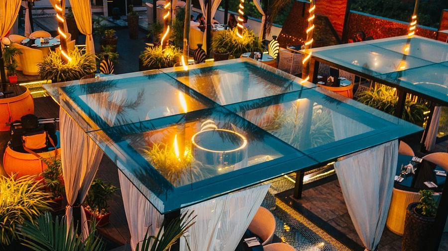 canopies placed across a restaurant with dining tables and chairs inside them - Hotel Park Elanza, Chennai