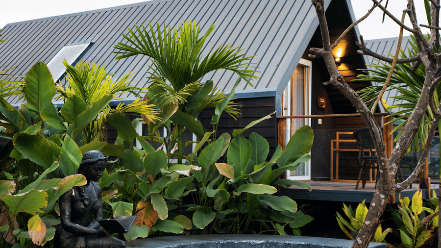 Artistic sculpture installation surrounded by lush greenery at Hotel Sonar Bangla, Taki.