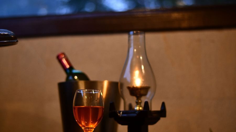 image of a wine platter with an oil lit lamp at hoysala village resort, hassan
