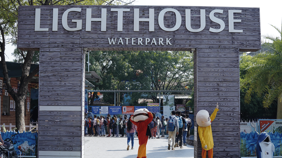 The entrance gate to the water park, featuring a sign that reads Lighthouse.