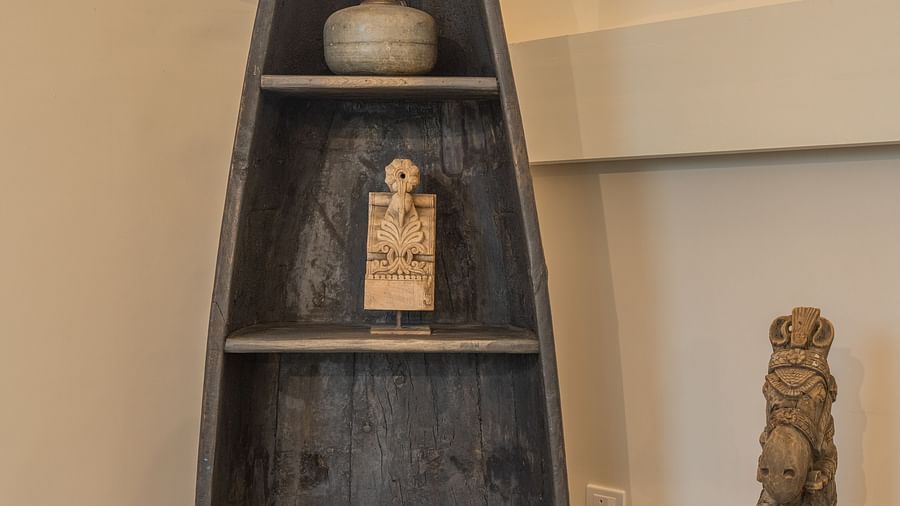 An image of a triangle cupboard where spa equipment are placed on the shelves - Rajbagh Wellness