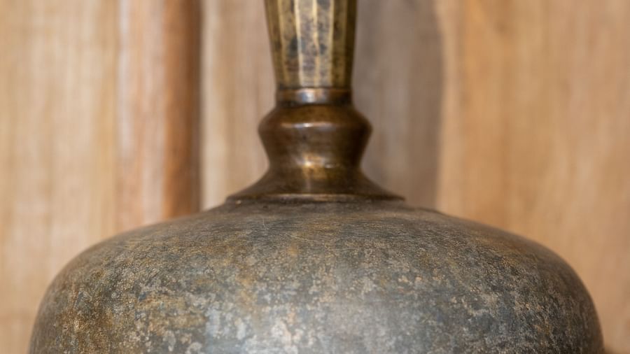 An image of a bass pot with a long handle on top - Rajbagh Wellness