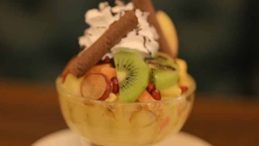 Fruit sundae with whipped cream and wafers, served at Royal Comfort Regency.