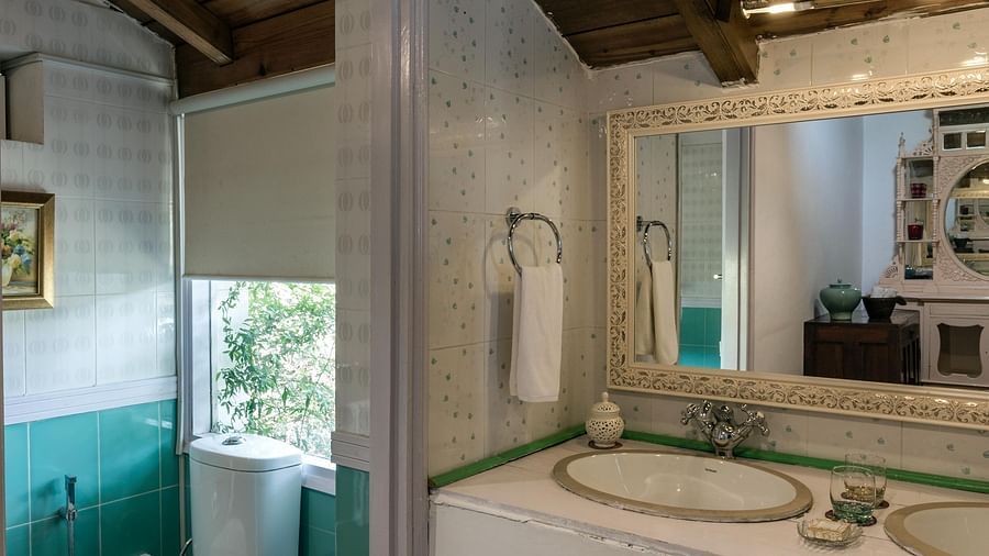 Washroom of the 2 bhk cottage with sink and a sperate area for toilet.