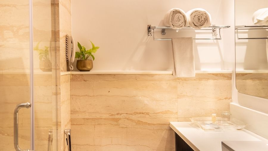 Toilet and shower area with glass partition and countertop- TGI Grand Fortuna, Krishnagiri Main Road, Hosur