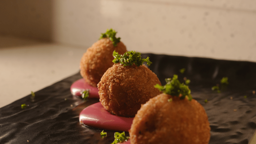 Elegant dessert platter with beautifully plated sweets and garnishes at Trino Bar