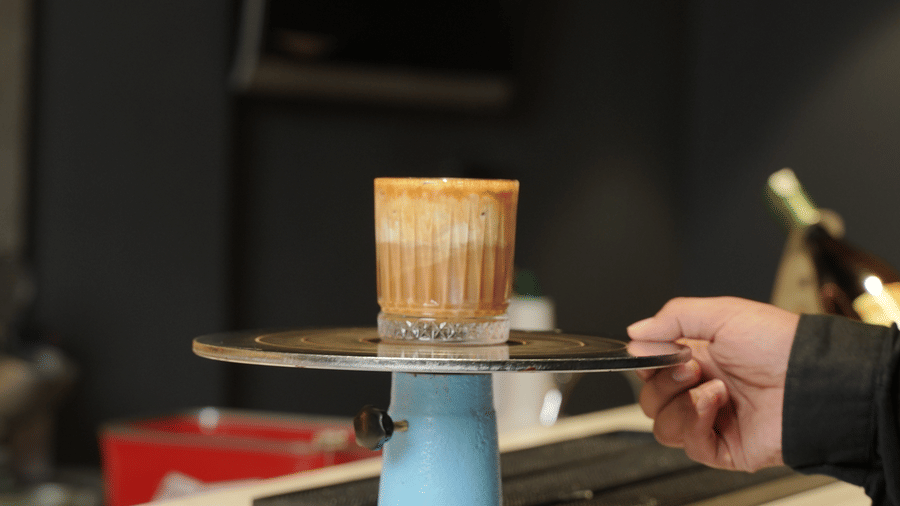 Citrine Hotel | A glass placed kept in a plate with drinks in it.