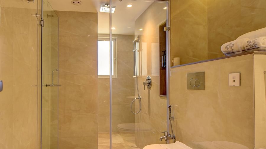 A hotel bathroom with a toilet and a sink, bright interior lighting - The SSK Solitaire Boutique Hotel & Spa, Gangapur Road - Nashik