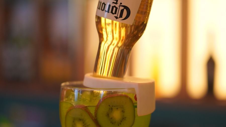 An image of a glass drink and above it there is a liquor bottle - Themis Barbecue House, Panipat