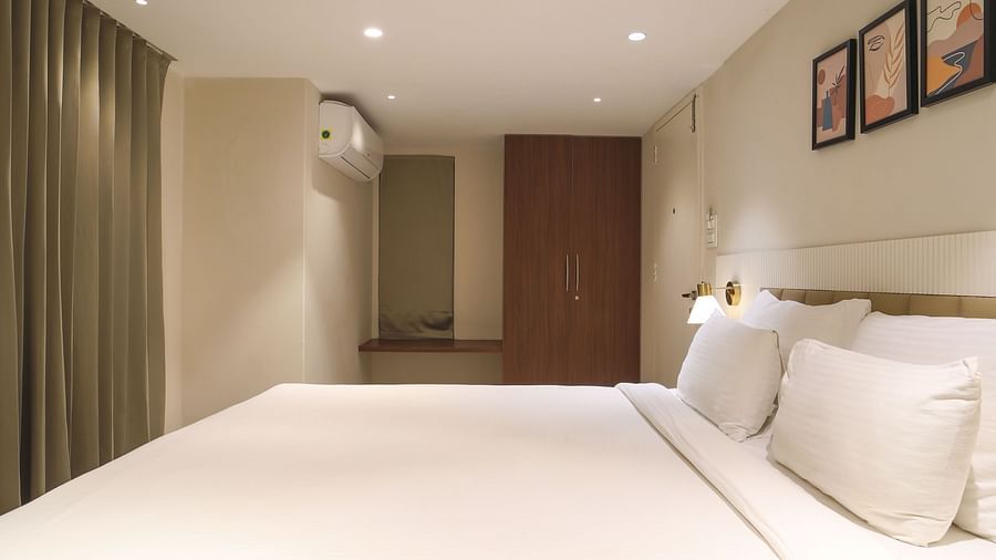 An image of a room with king size bed, bed side tables, lamps - Trance Veechika Resort, Vikarabad