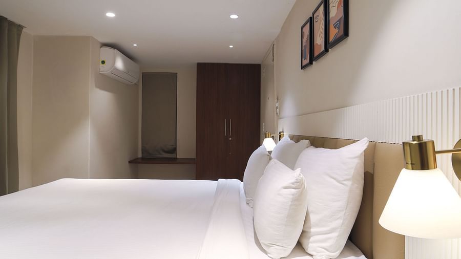 An image of a room with king size bed, bed side tables, lamps - Trance Veechika Resort, Vikarabad