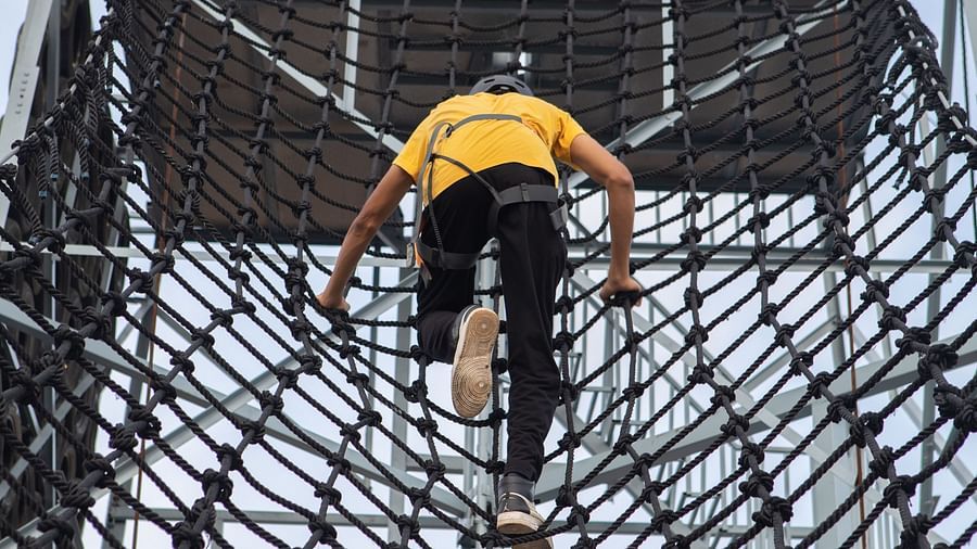An image of a person doing the activity of net climbing - Trance Veechika Resort, Vikarabad