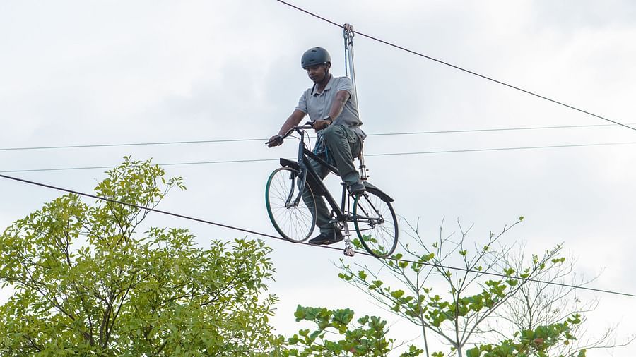 An image of a person doing zip cycling - Trance Veechika Resort, Vikarabad