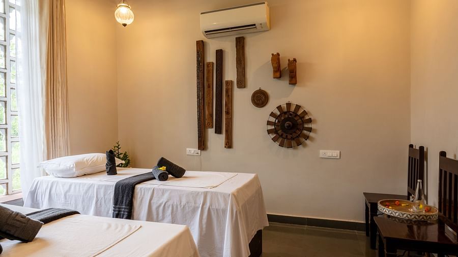 A image of the spa with beds and comfortable chairs - Utsav Camp