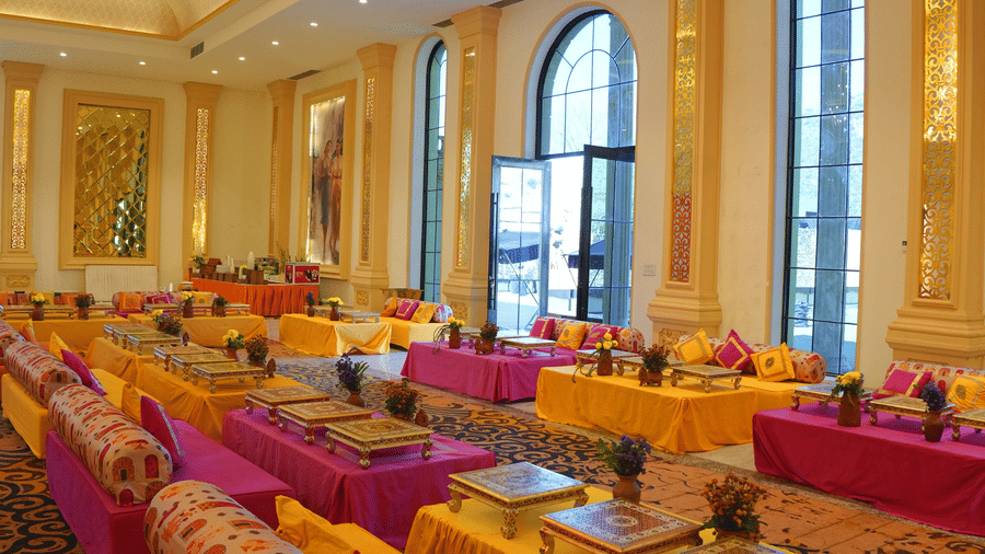 Floor cushions arranged for an outdoor function at Valley by Grassfield, a wedding venue in Jaipur.