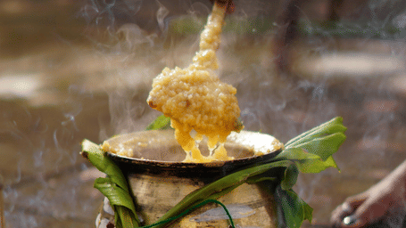 Traditional offering worship with fruits, coconut and flowers arranged for ritual, symbolising devotion and sacred practices