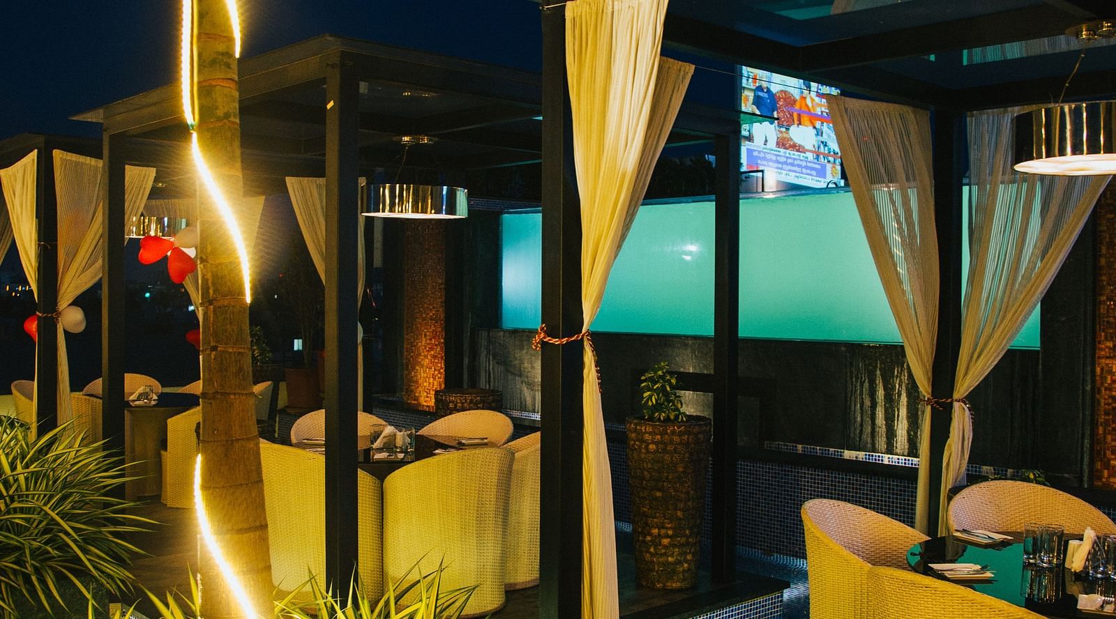 view of canopies with trees in between decorated with lights - Hotel Park Elanza, Chennai