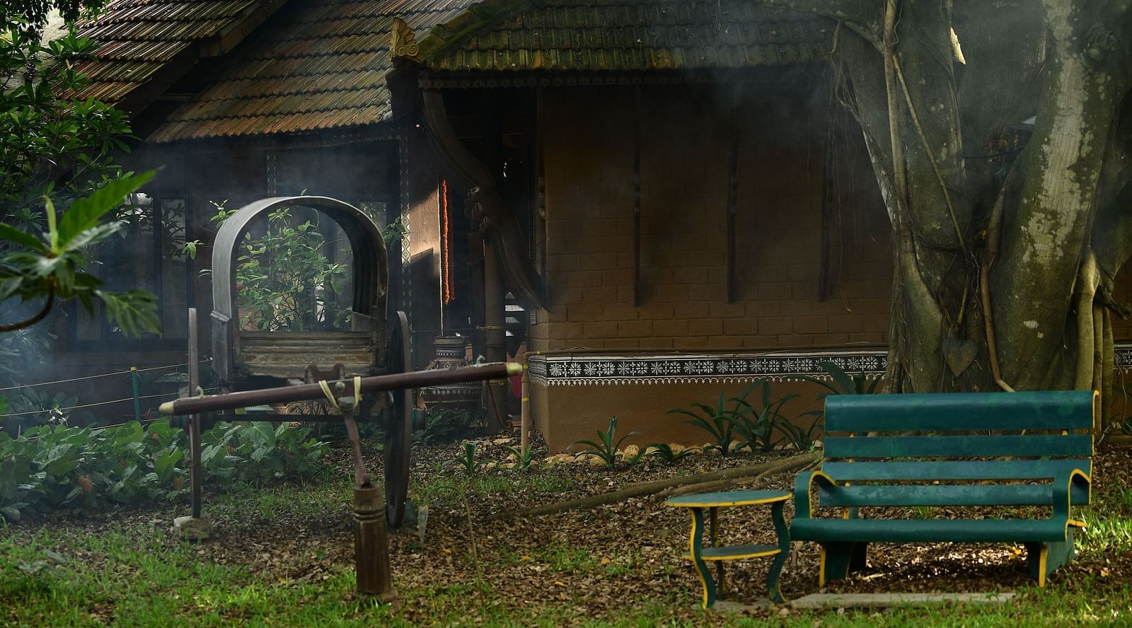 a garden with green grass at with sitting area