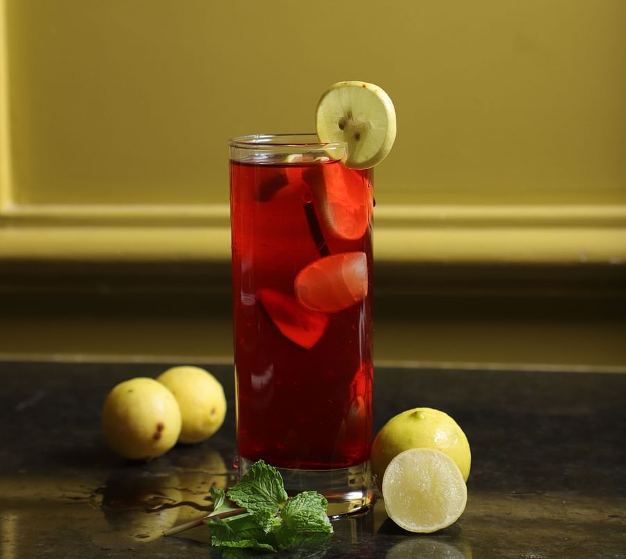 An image of a cocktail served with sliced lemons at a restaurant at Five Elements Hotel, Jodhpur 
