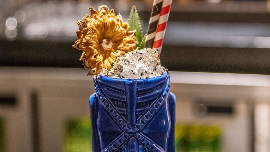 image of the signature cocktail - city of birds served at the aura bar at The Claridges New Delhi