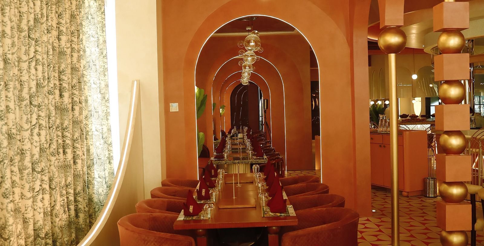 An image of a long dining table with chairs on either side at - Themis Barbecue House, Ambala