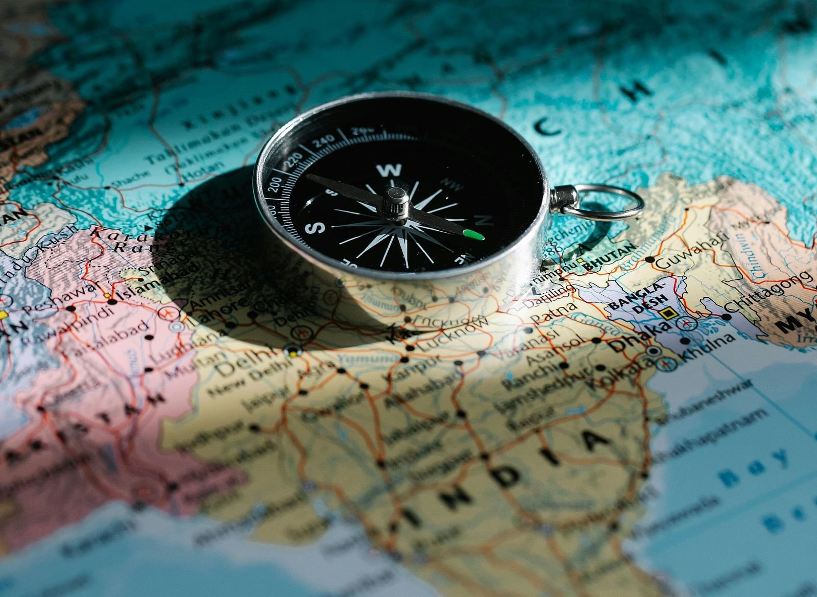 A compass placed on a map of India.