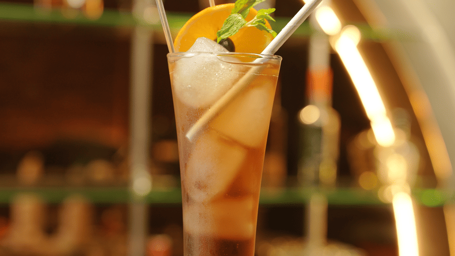 Citrine Hotel | A glass placed on a table with drinks in it.