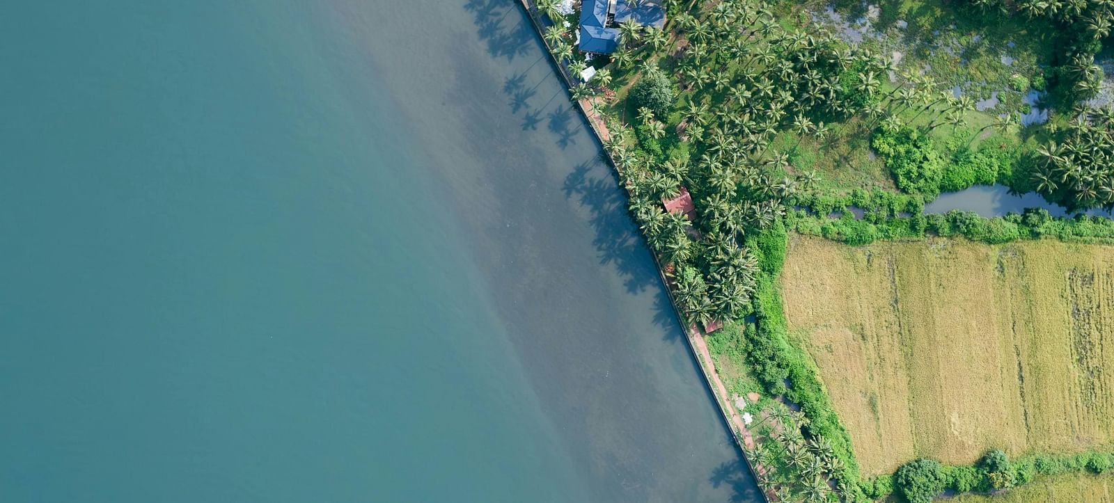 An aerial view of Pernem a coastal village in Goa, featuring the coastline.