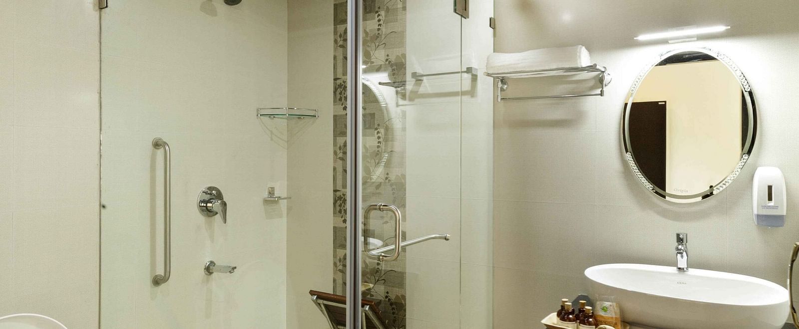 A modern bathroom with a glass-enclosed shower and a sink.