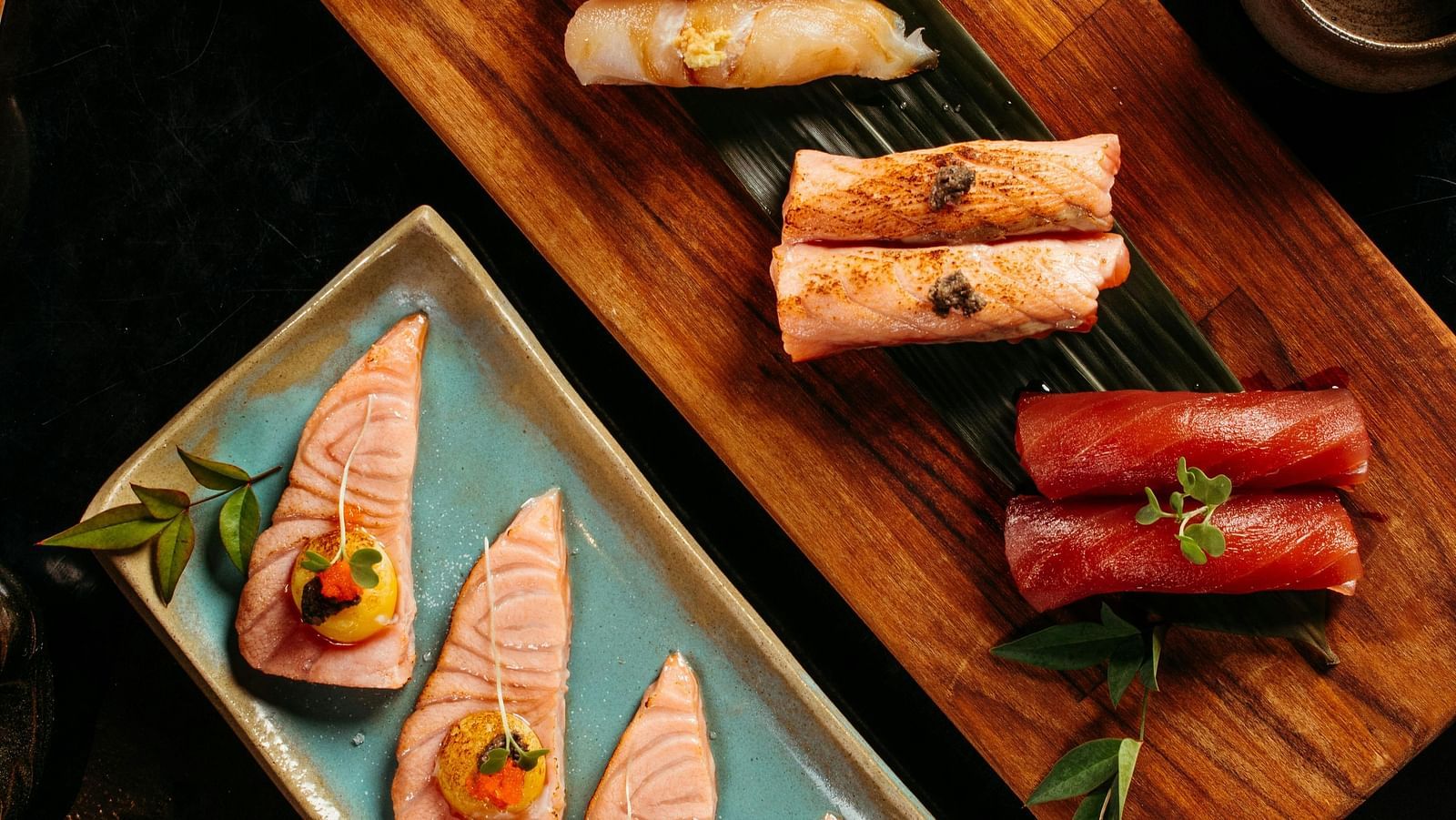 top angle shot of a sushi platter served with soy sauce