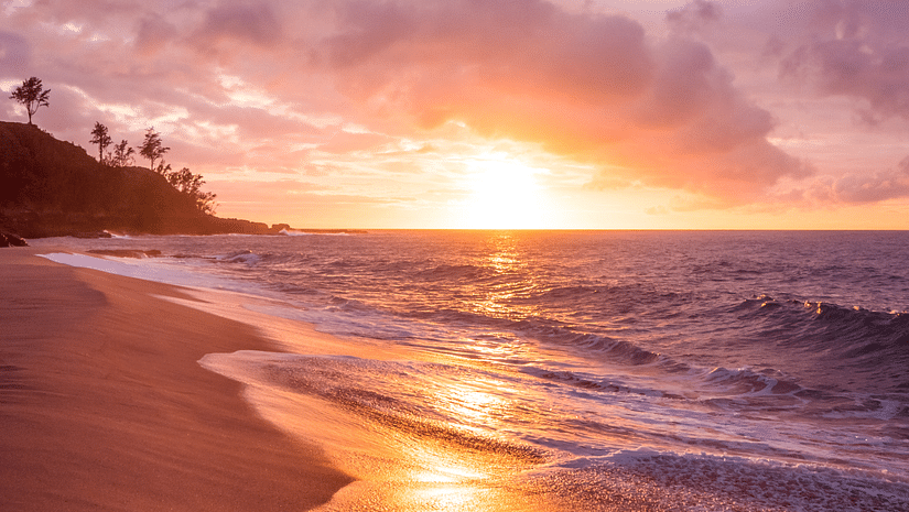 A beautiful view of waves washing the shore during sunset - Tharangambadi Places to Visit