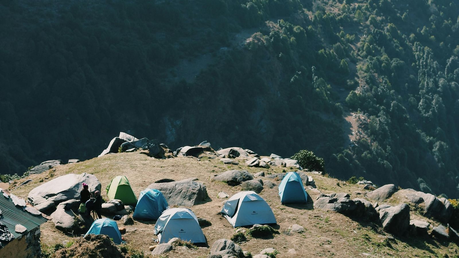 image featuring a hut with camp tents placed on the edge of the cliff in dharamshala