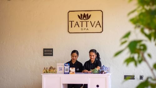Women sitting behind the counter at Tattva Spa