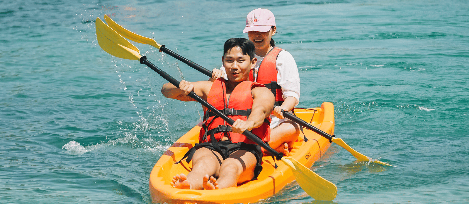 A group of people kayaking on a river