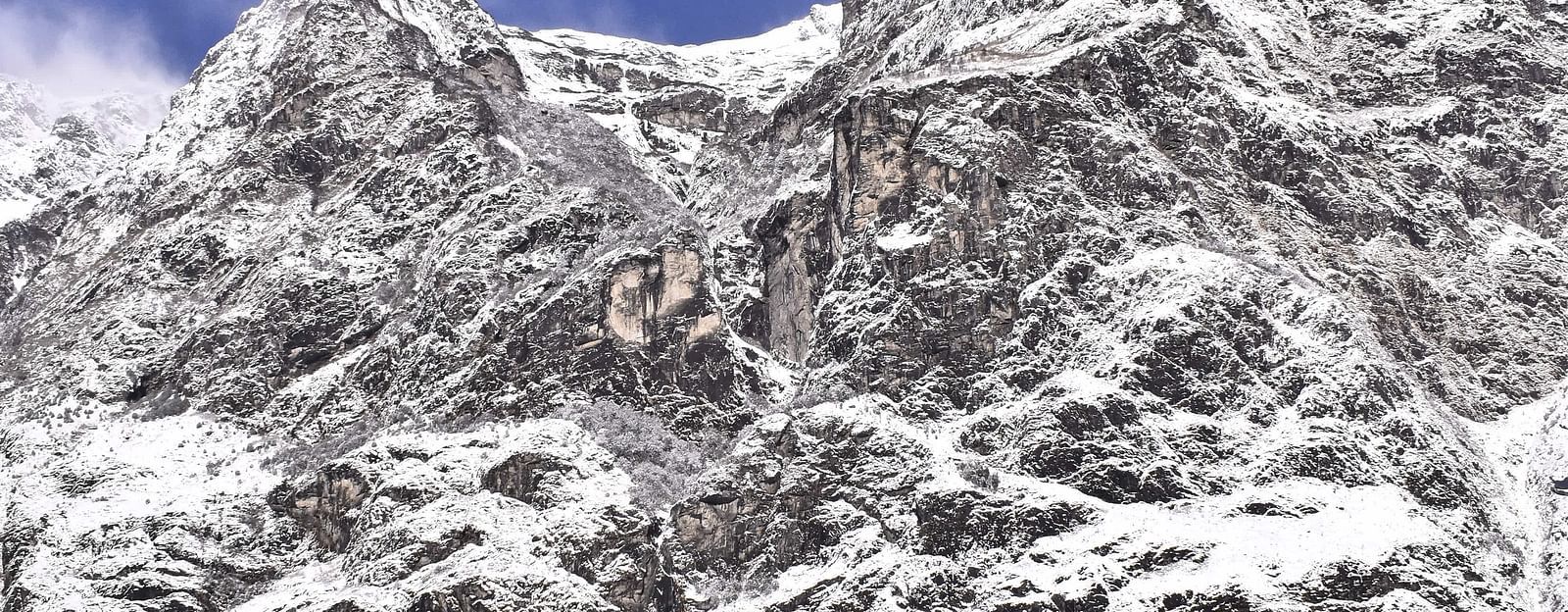 view of a snow-capped mountain from a hotel balcony