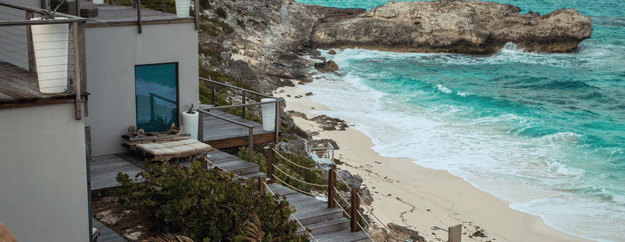 Villas near a beach with the blue sky in the background