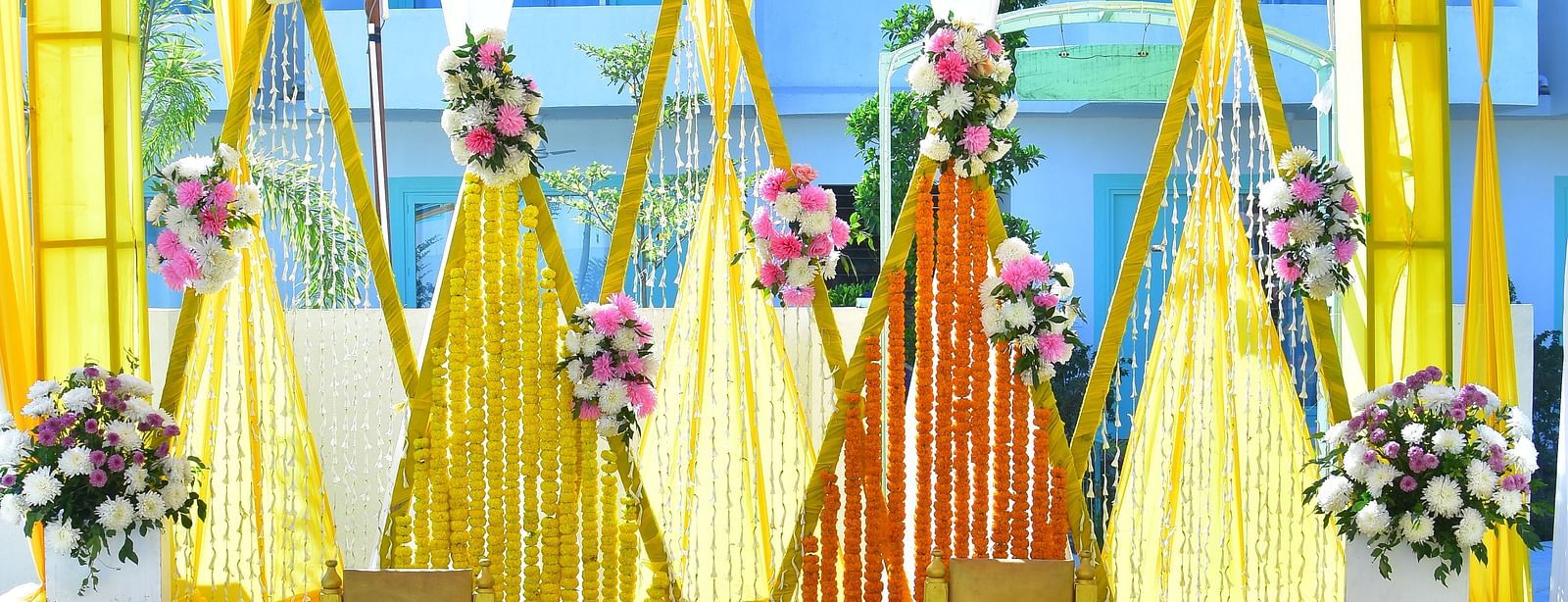 Traditional swing setup with yellow drapes for a mehendi ceremony at Vedikant Resorts The Mallard Corbett.