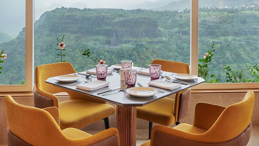 Image of a cafe with seating area overlooking the Kune falls at The Dukes Retreat