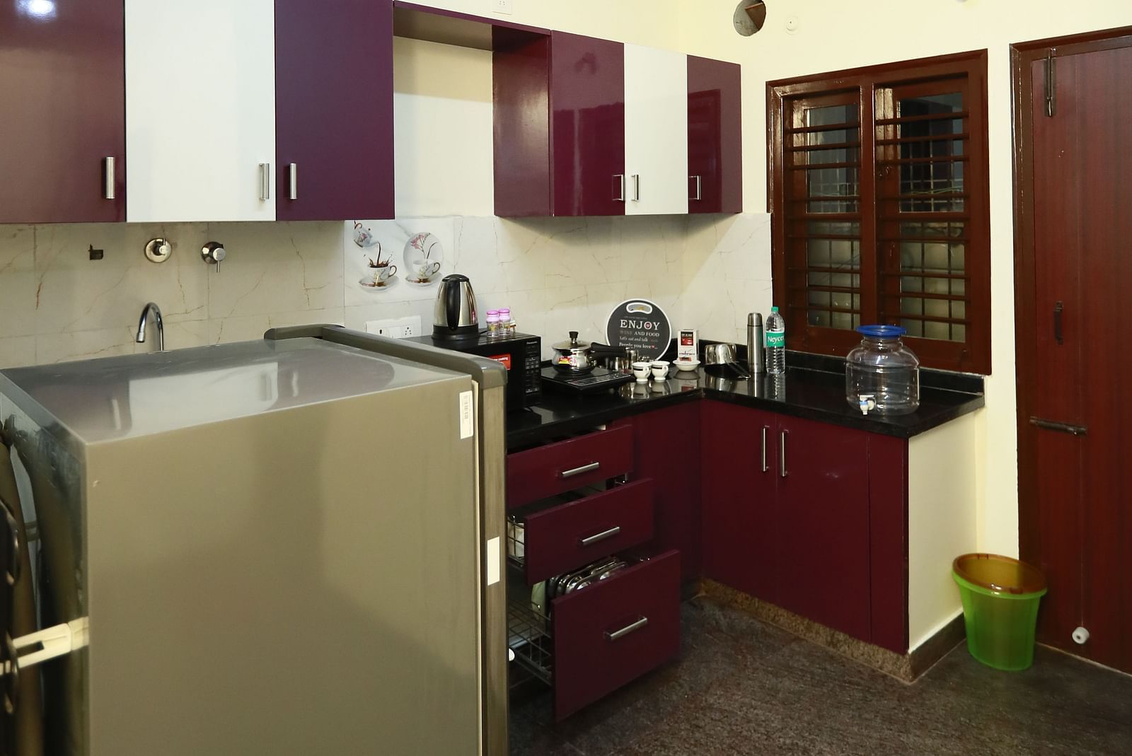 A fully equipped kitchenette at Tranquil ABS Orchid Serviced Apartments.