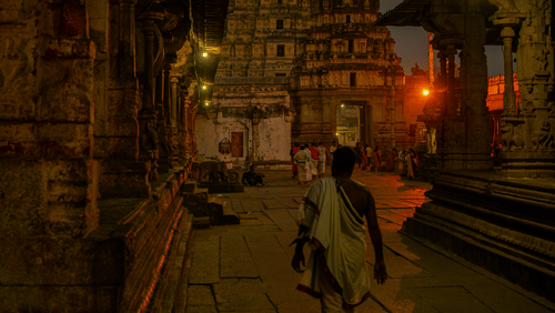 Man walking towards the magnificent Tirupati Temple