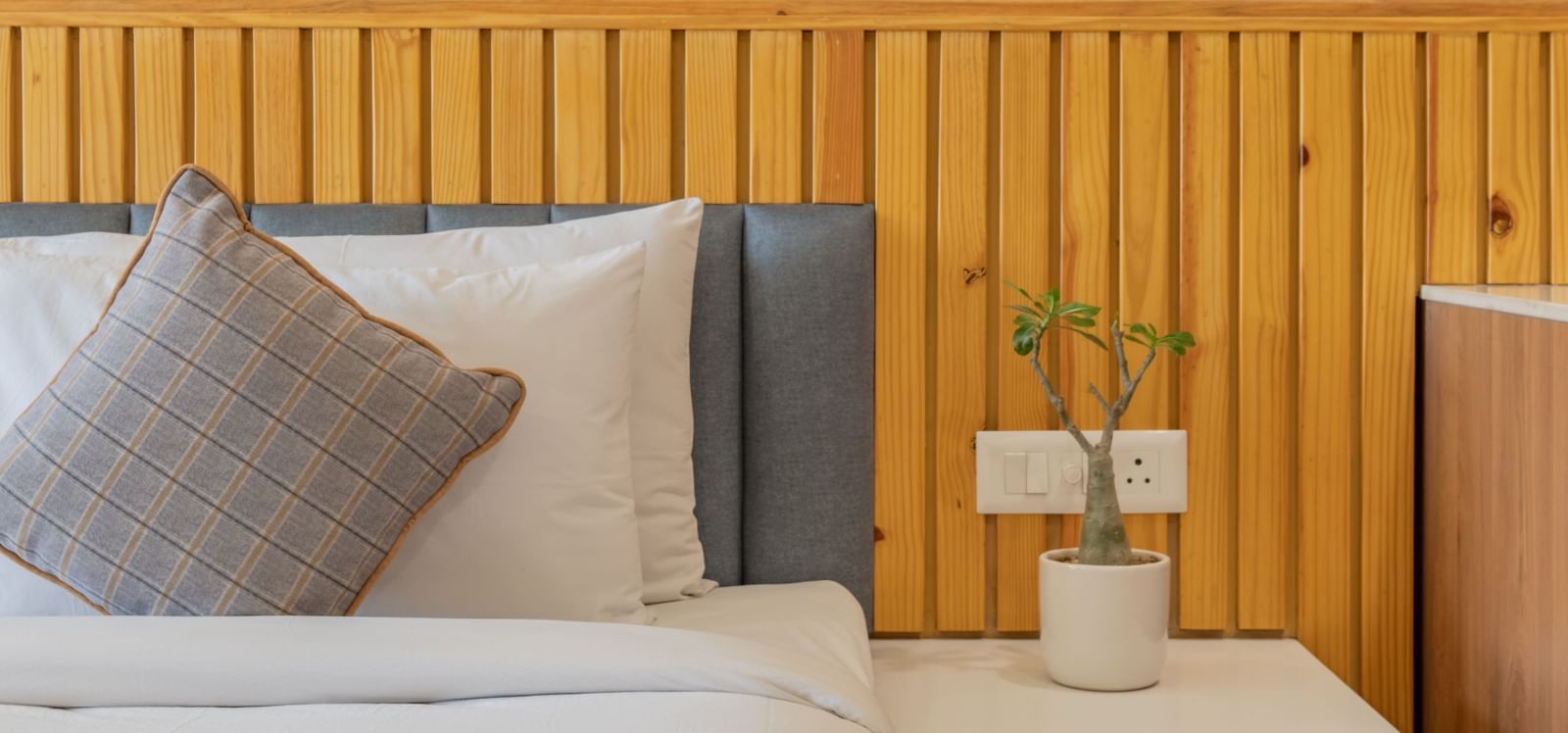 A deluxe room with a half view of the bed and a coffee table at Hotel Highway King, Bagru