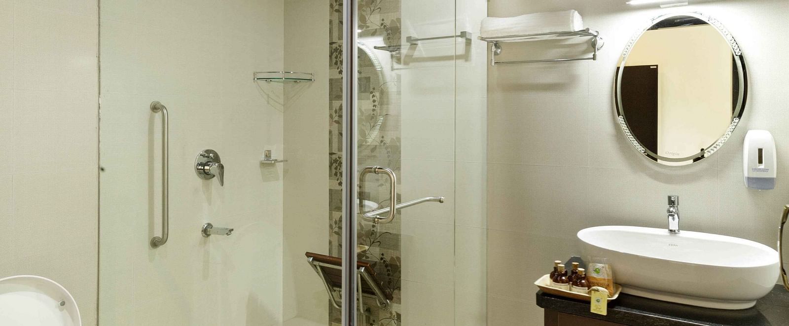 A modern bathroom with a glass-enclosed shower and a sink.