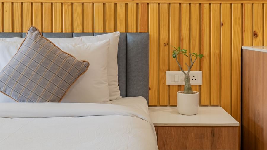 A deluxe room with a half view of the bed and a coffee table at Hotel Highway King, Bagru