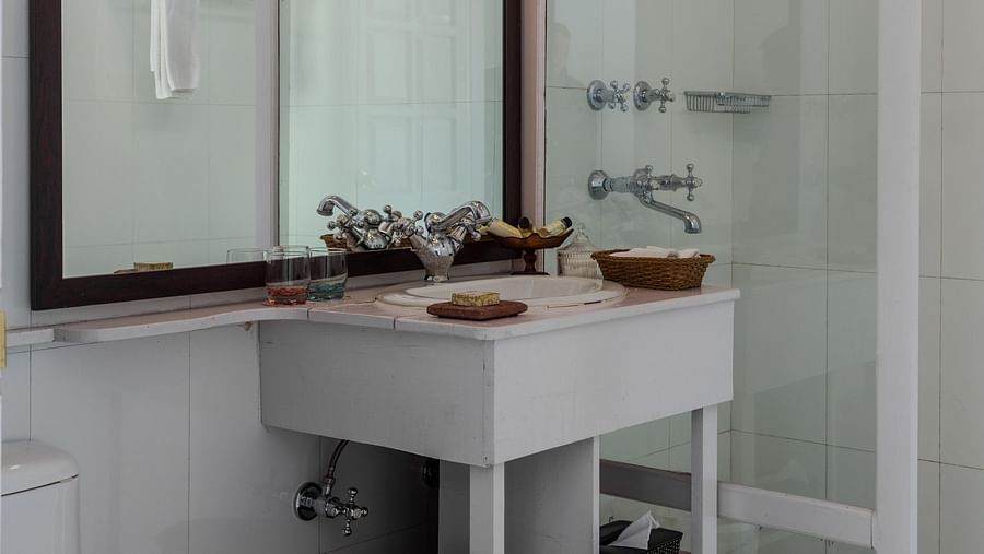 Room with mirror and vanity table with toiletries at Te Aroha by Shervani Mukteshwar