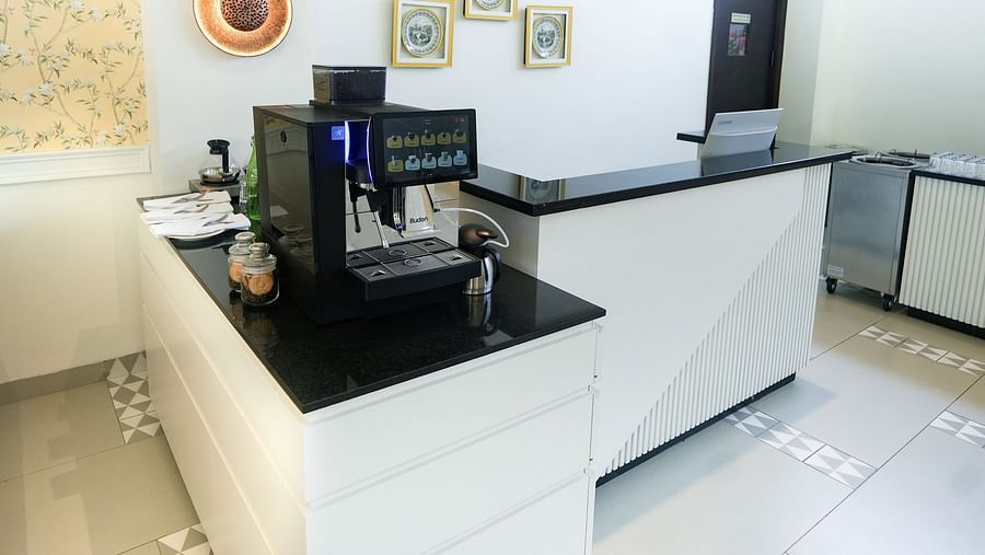 An image of a modern coffee maker placed on a counter at our restaurant in Bankhandi - NAMAMI BY ZENQ BANKHANDI